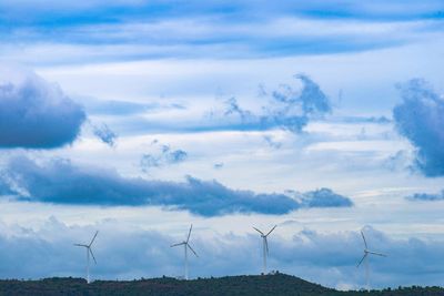 Wind turbines along the Tehachapi mountain ridgeline above the valley